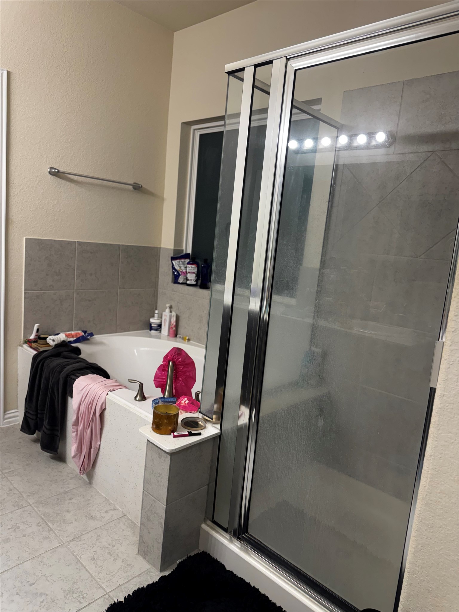 22739 Highland Maple Court Spring, TX 77373 - Photo 39 of 48 a bathroom with a tub and a shower