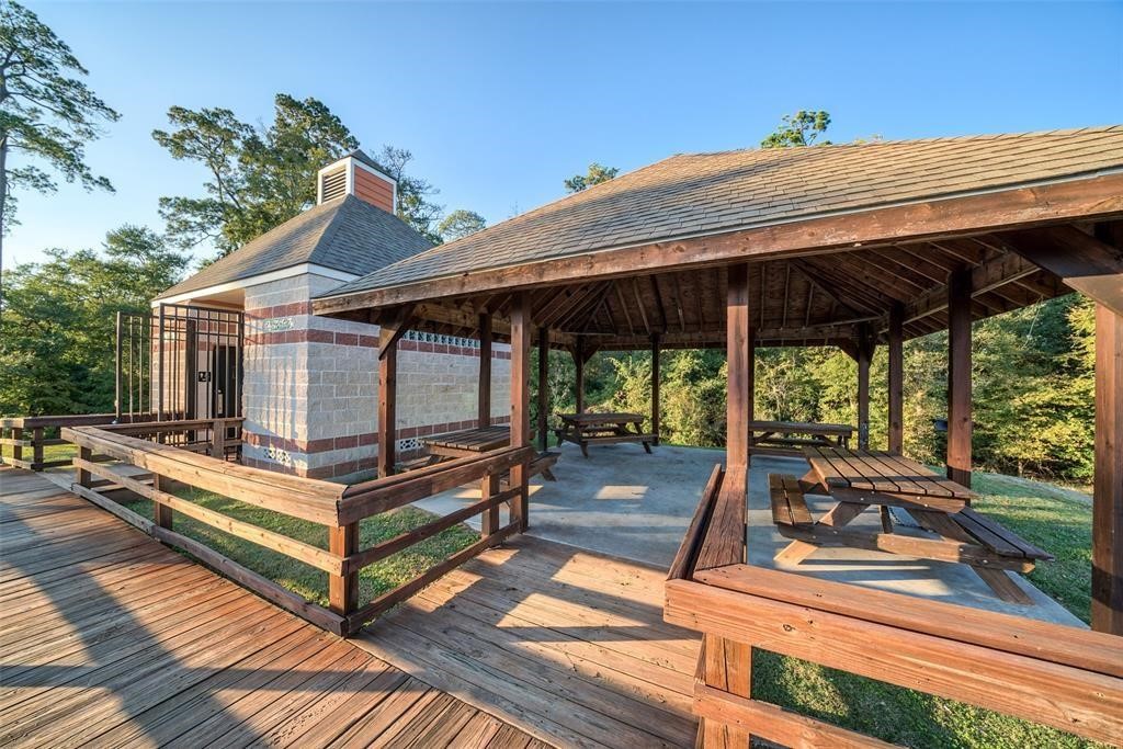 22739 Highland Maple Court Spring, TX 77373 - Photo 45 of 48 a view of a roof deck with wooden floor and roof with a small garden