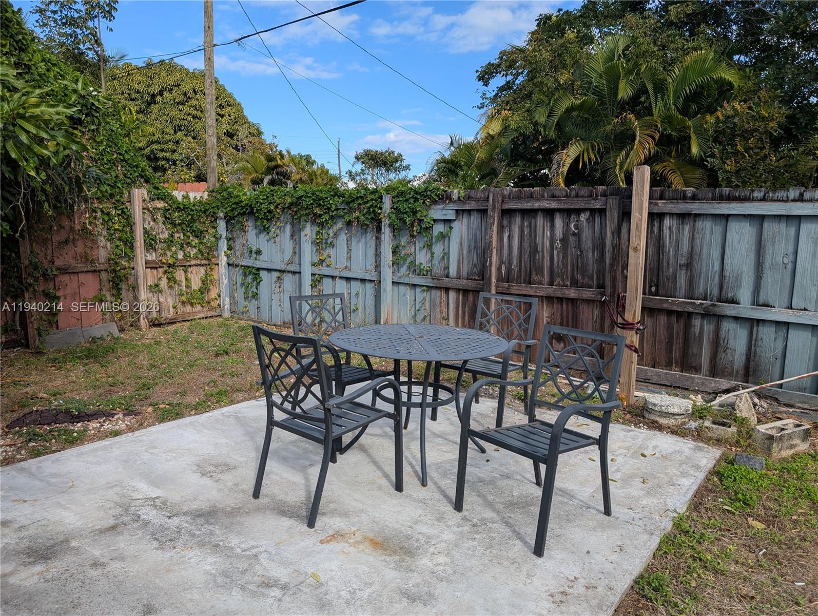 311 Southwest 2nd Avenue, Unit 1 Dania Beach, FL 33004 - Photo 14 of 14 a view of a chairs and table in the patio