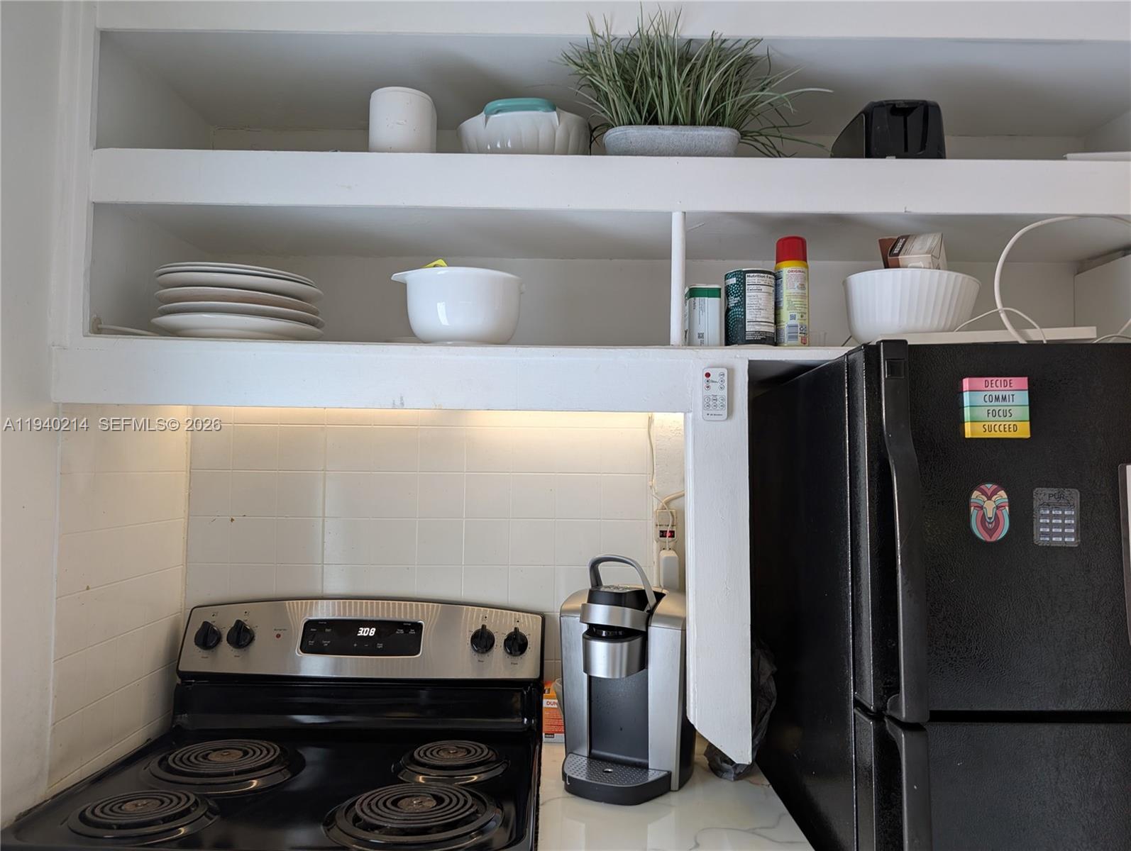 311 Southwest 2nd Avenue, Unit 1 Dania Beach, FL 33004 - Photo 9 of 14 a room with storage and utility