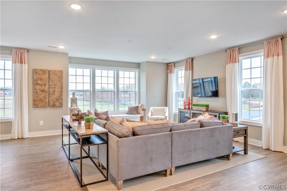 4359 Saunders Station Loop, Unit B Richmond, VA 23233 - Photo 20 of 31 a living room with furniture and large windows