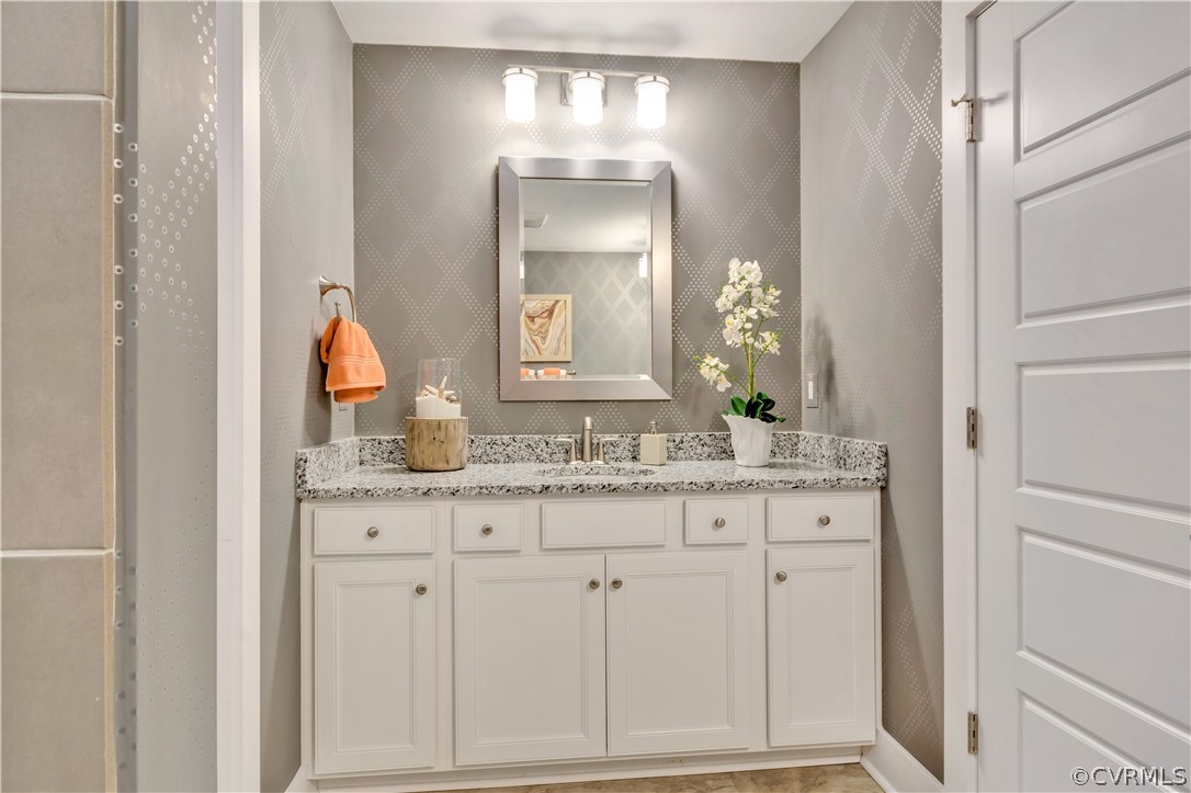 4359 Saunders Station Loop, Unit B Richmond, VA 23233 - Photo 27 of 31 a bathroom with granite countertop white vanity and a sink