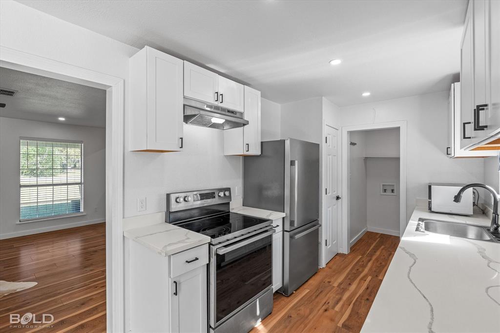 3407 Hickory Ridge Road Shreveport, LA 71108 - Photo 17 of 35 Kitchen featuring stainless steel appliances, recessed lighting, white cabinets, and dark wood-style flooring