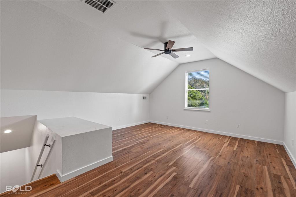 3407 Hickory Ridge Road Shreveport, LA 71108 - Photo 21 of 35 Bonus room with wood finished floors, lofted ceiling, a textured ceiling, and a ceiling fan
