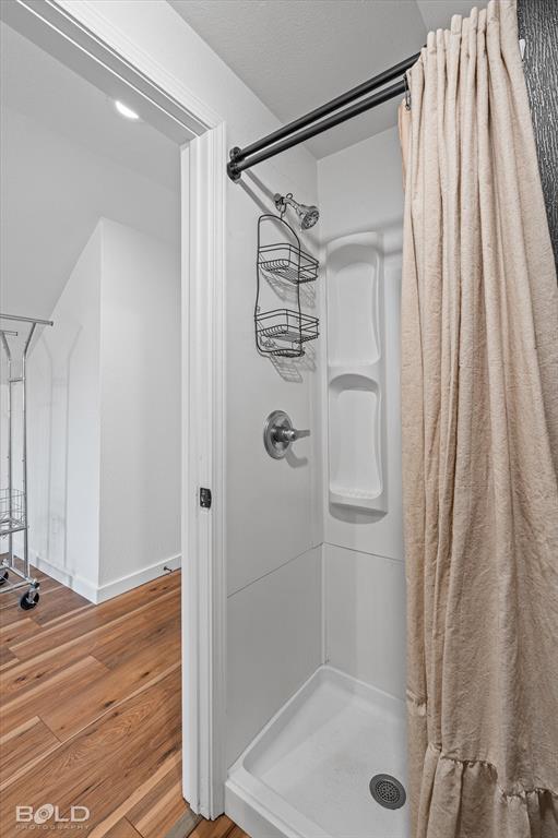 3407 Hickory Ridge Road Shreveport, LA 71108 - Photo 24 of 35 Bathroom featuring wood finished floors and a shower stall