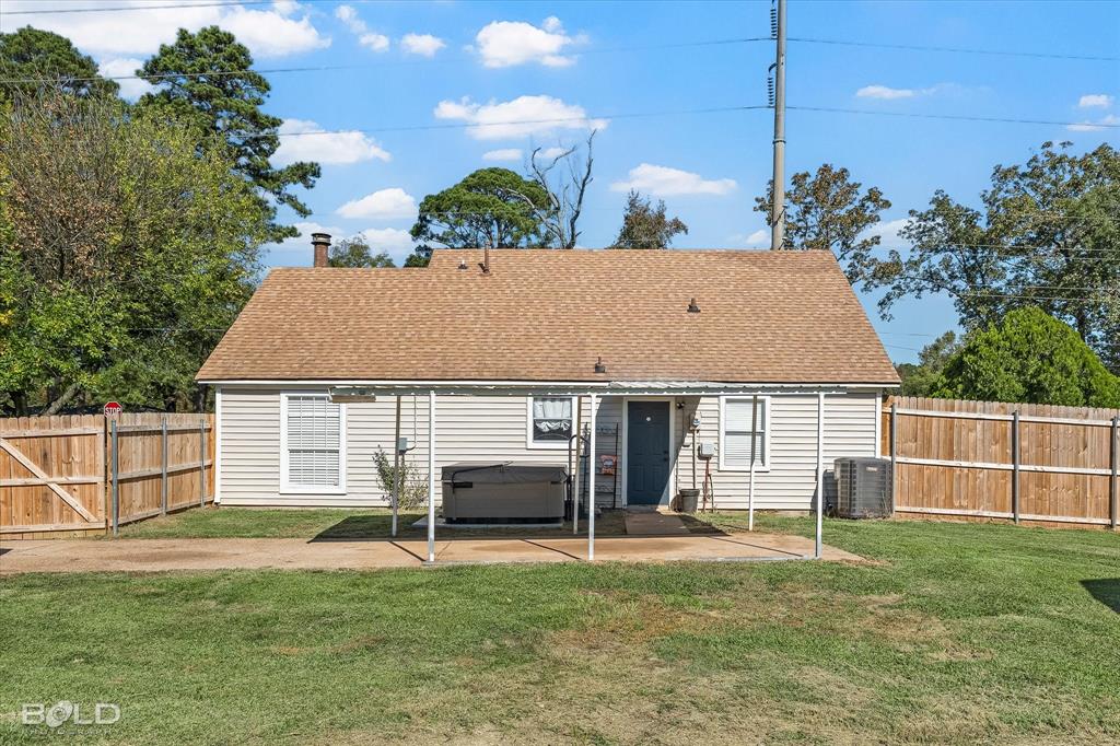 3407 Hickory Ridge Road Shreveport, LA 71108 - Photo 33 of 35 Rear view of house featuring a patio, a fenced backyard, a hot tub, a shingled roof, and a gate