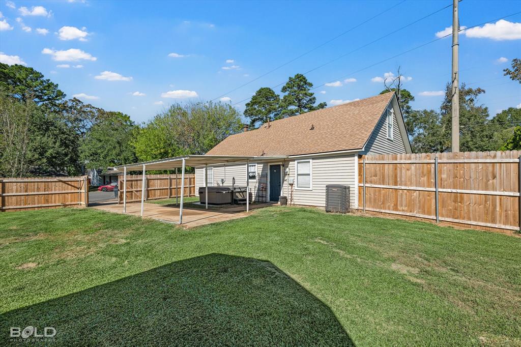 3407 Hickory Ridge Road Shreveport, LA 71108 - Photo 34 of 35 Back of house with a fenced backyard, a patio, and roof with shingles