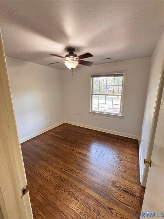 7019 Fairpines Road Richmond, VA 23234 - Photo 8 of 18 Room with rich wood-finish flooring, white walls,