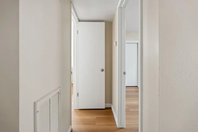 a view of front door with wooden floor