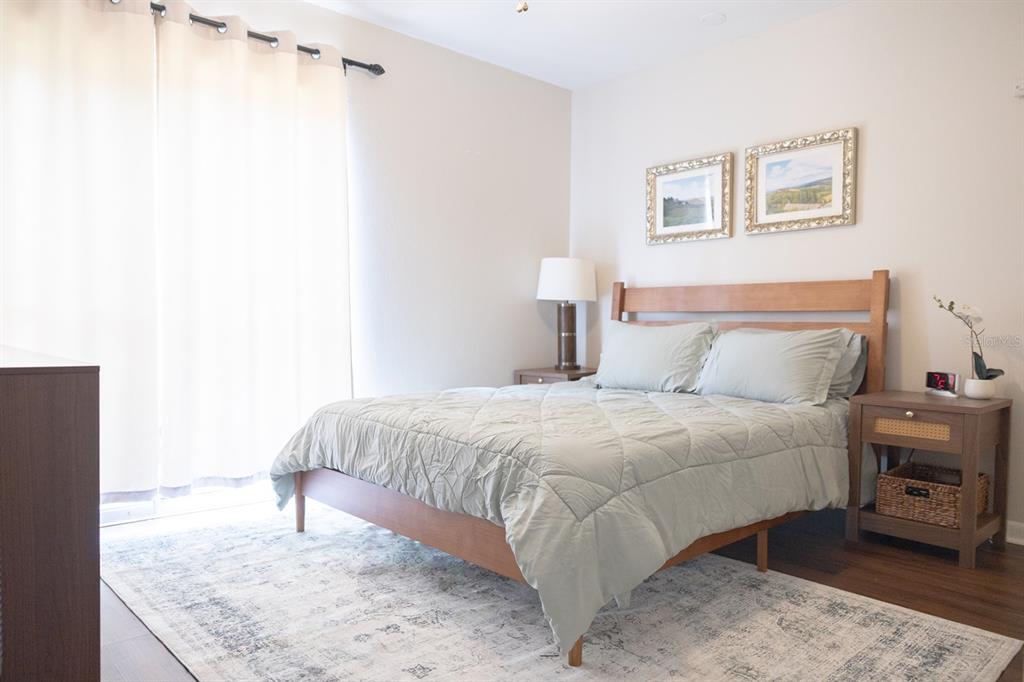 1700 Southwest 16th Court, Unit C5 Gainesville, FL 32608 - Photo 12 of 15 a bedroom with a bed and a couch