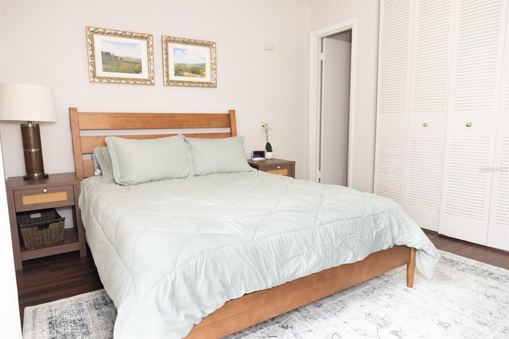 1700 Southwest 16th Court, Unit C5 Gainesville, FL 32608 - Photo 13 of 15 a large bed sitting in a bedroom next to a window