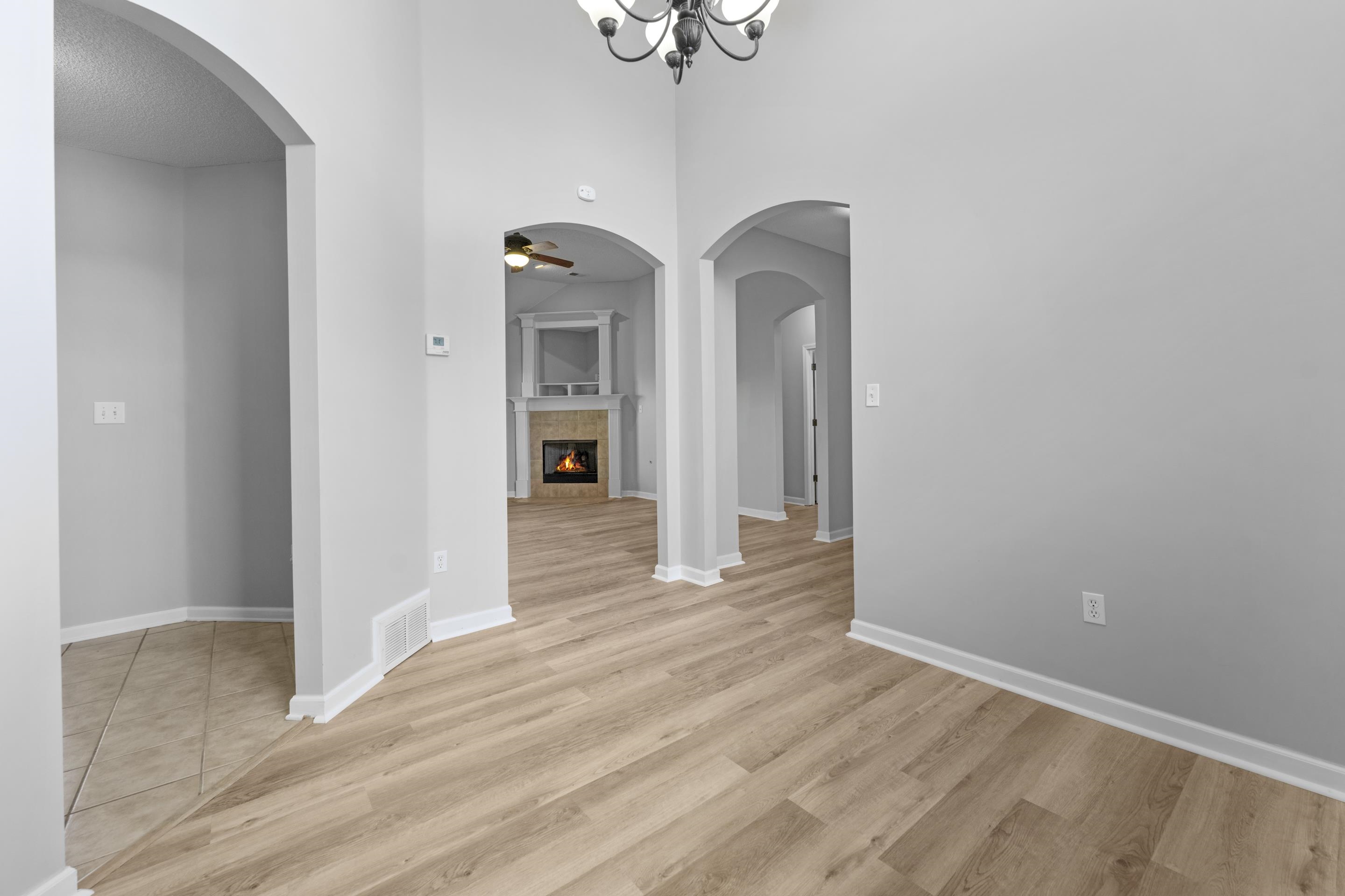 50 Abbey Road Oakland, TN 38060 - Photo 11 of 26 Light wood-finish flooring extending through an arched entryway