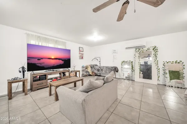 a living room with furniture and a large window