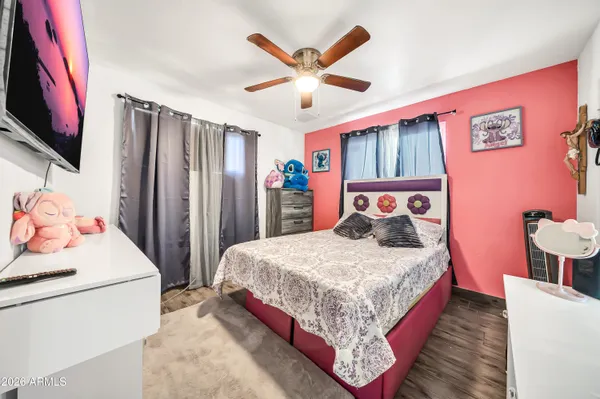 a living room with a bed and furniture