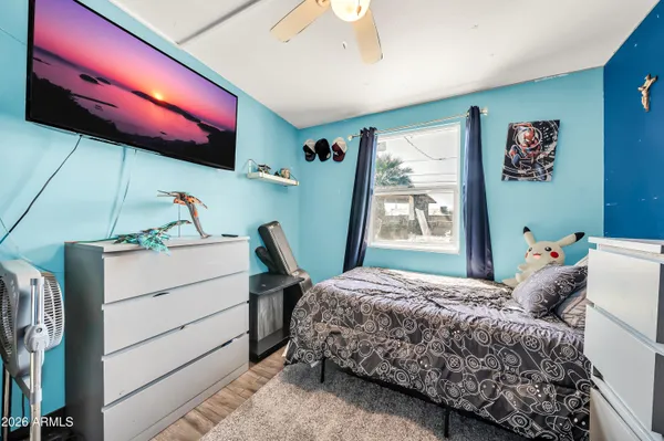 a white toilet sitting next to a shower curtain