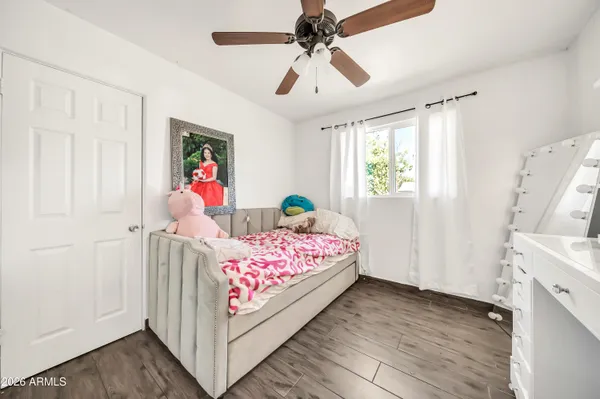 a bedroom with a bed and a dresser