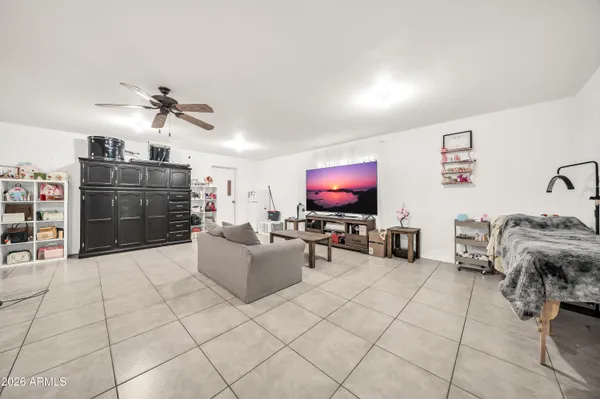 a bedroom with a bed and a dresser
