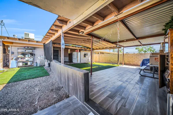 a kitchen with white cabinets and appliances