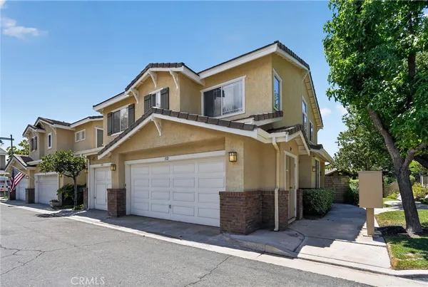 a front view of a house with a garage