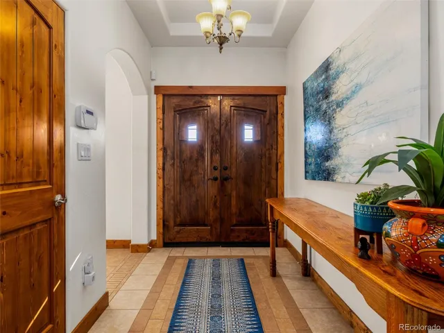 a hallway with sliding door and wooden floor