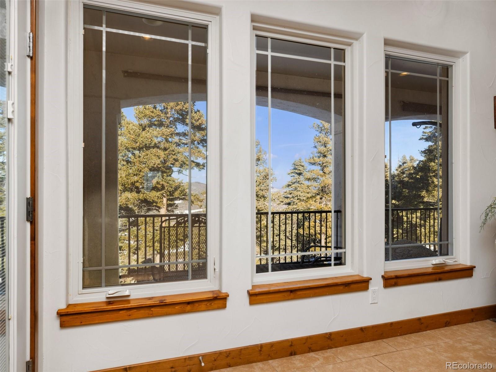 8760 Ridge Road Beulah, CO 81023 - Photo 20 of 49 a view of a porch with a door and a window