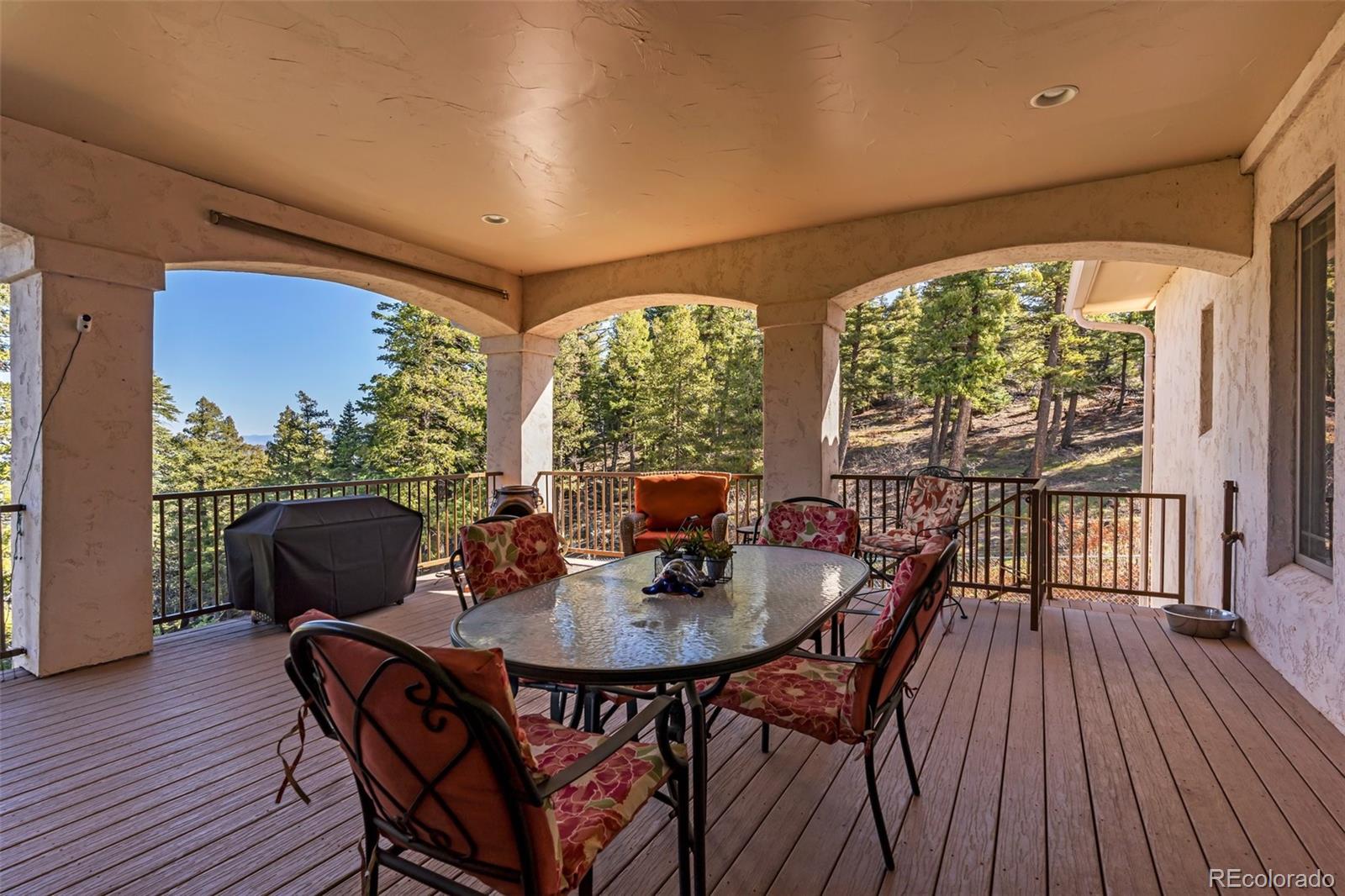 8760 Ridge Road Beulah, CO 81023 - Photo 32 of 49 a dining room with furniture window and wooden floor
