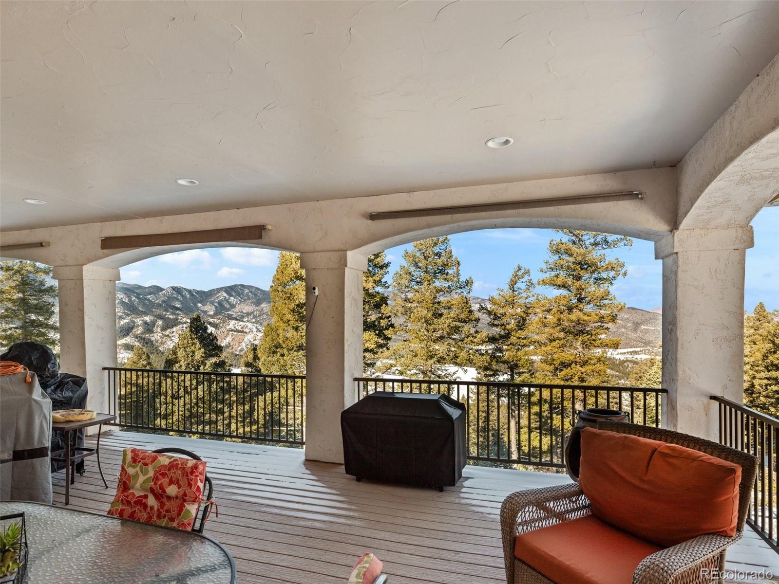 8760 Ridge Road Beulah, CO 81023 - Photo 33 of 49 a balcony with furniture and a large window
