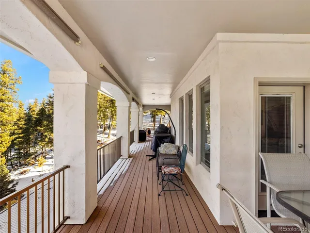 a view of a balcony with wooden floor