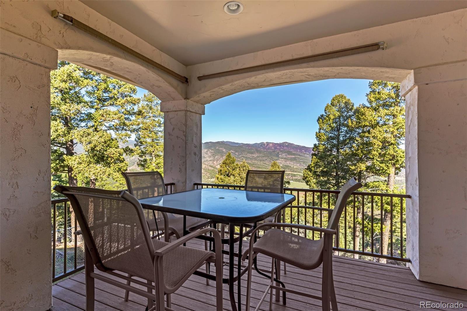 8760 Ridge Road Beulah, CO 81023 - Photo 37 of 49 a view of a dining room with furniture and a window