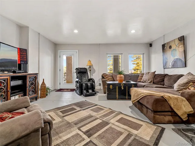 a living room with furniture and a couch