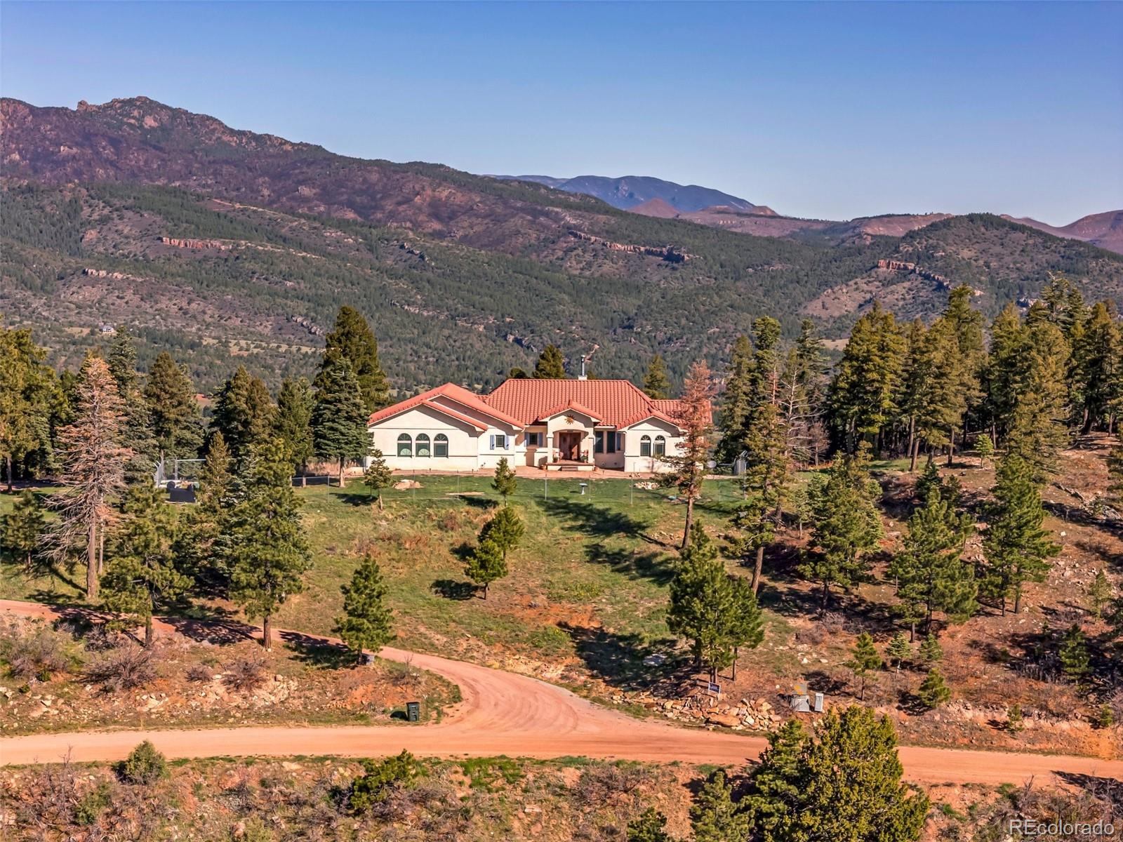 8760 Ridge Road Beulah, CO 81023 - Photo 45 of 49 a view of a house with a mountain