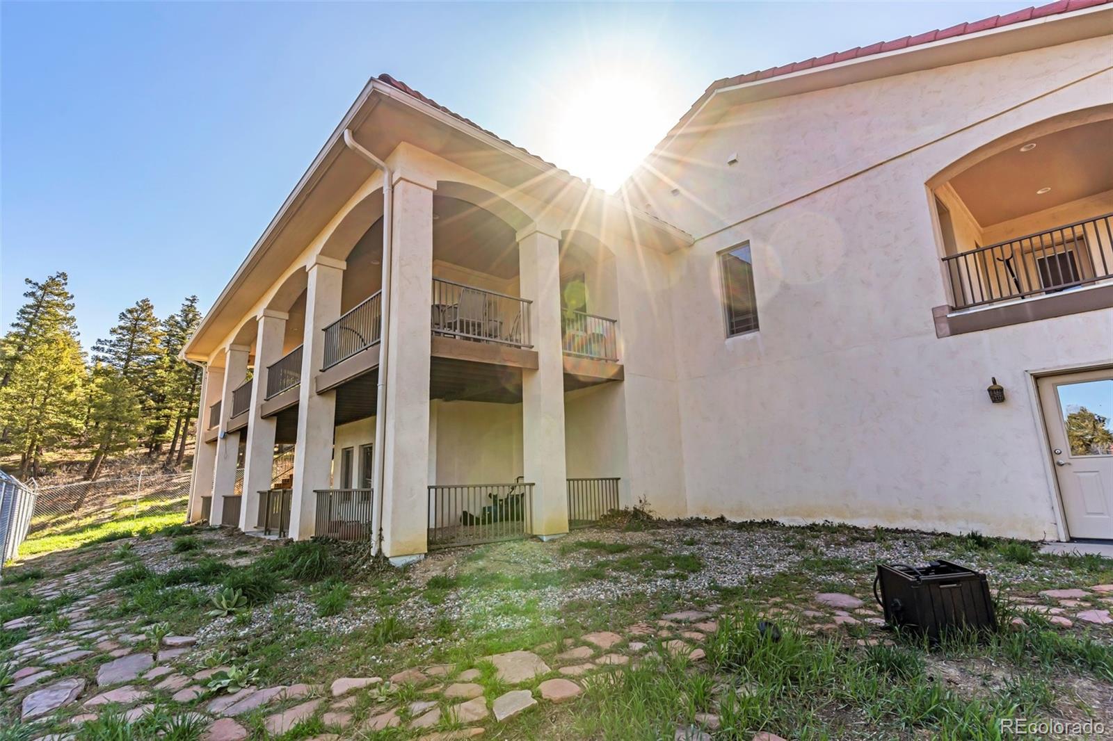8760 Ridge Road Beulah, CO 81023 - Photo 5 of 49 a view of a house with a yard