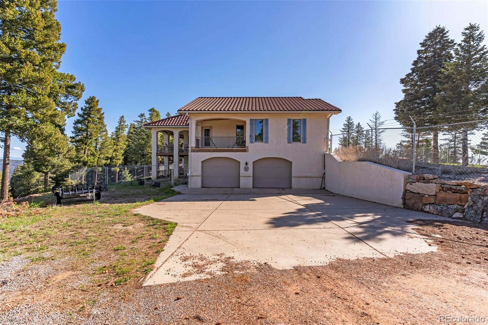 8760 Ridge Road Beulah, CO 81023 - Photo 6 of 49 a front view of a house with a yard