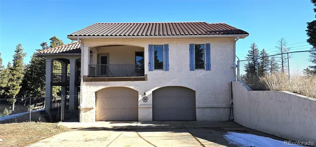 a front view of a house with parking