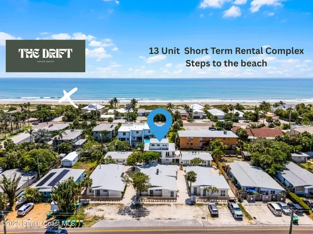 an aerial view of a house with a garden