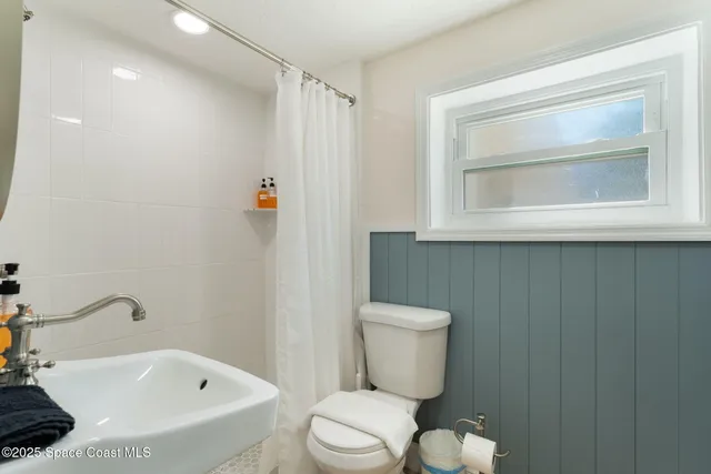 a view of a dining room with furniture and window