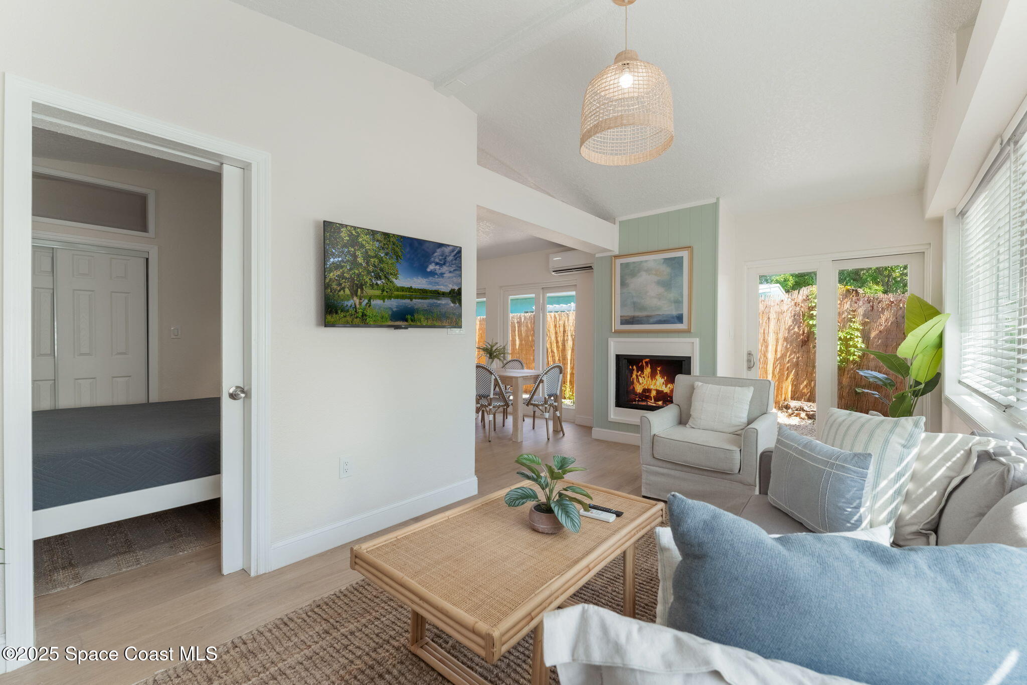637 South Orlando Avenue Cocoa Beach, FL 32931 - Photo 19 of 83 a living room with furniture and a fireplace