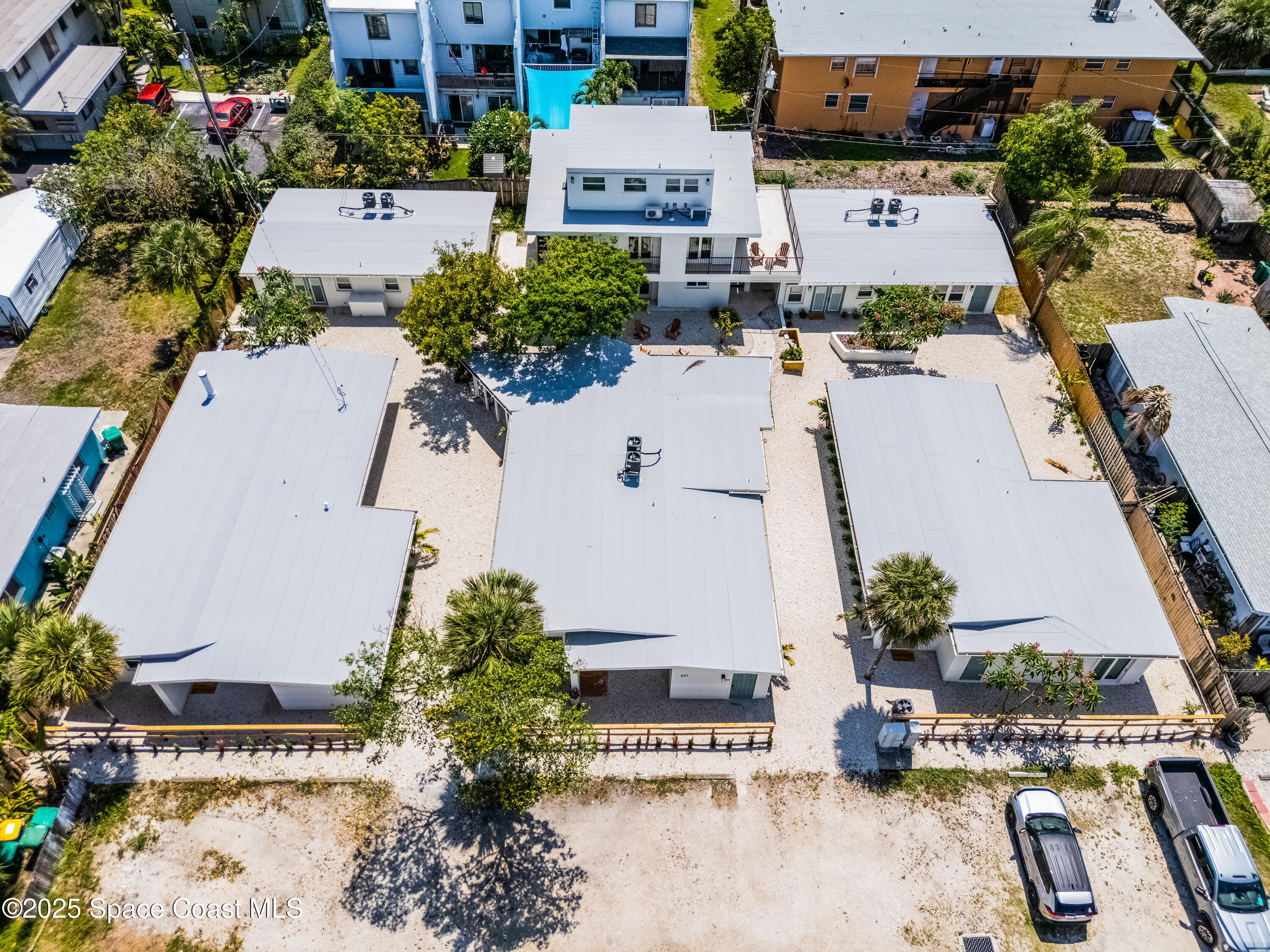 637 South Orlando Avenue Cocoa Beach, FL 32931 - Photo 2 of 83 an aerial view of a house with a garden