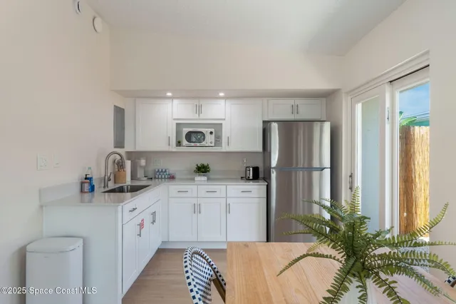 a bedroom with a bed and a night stand