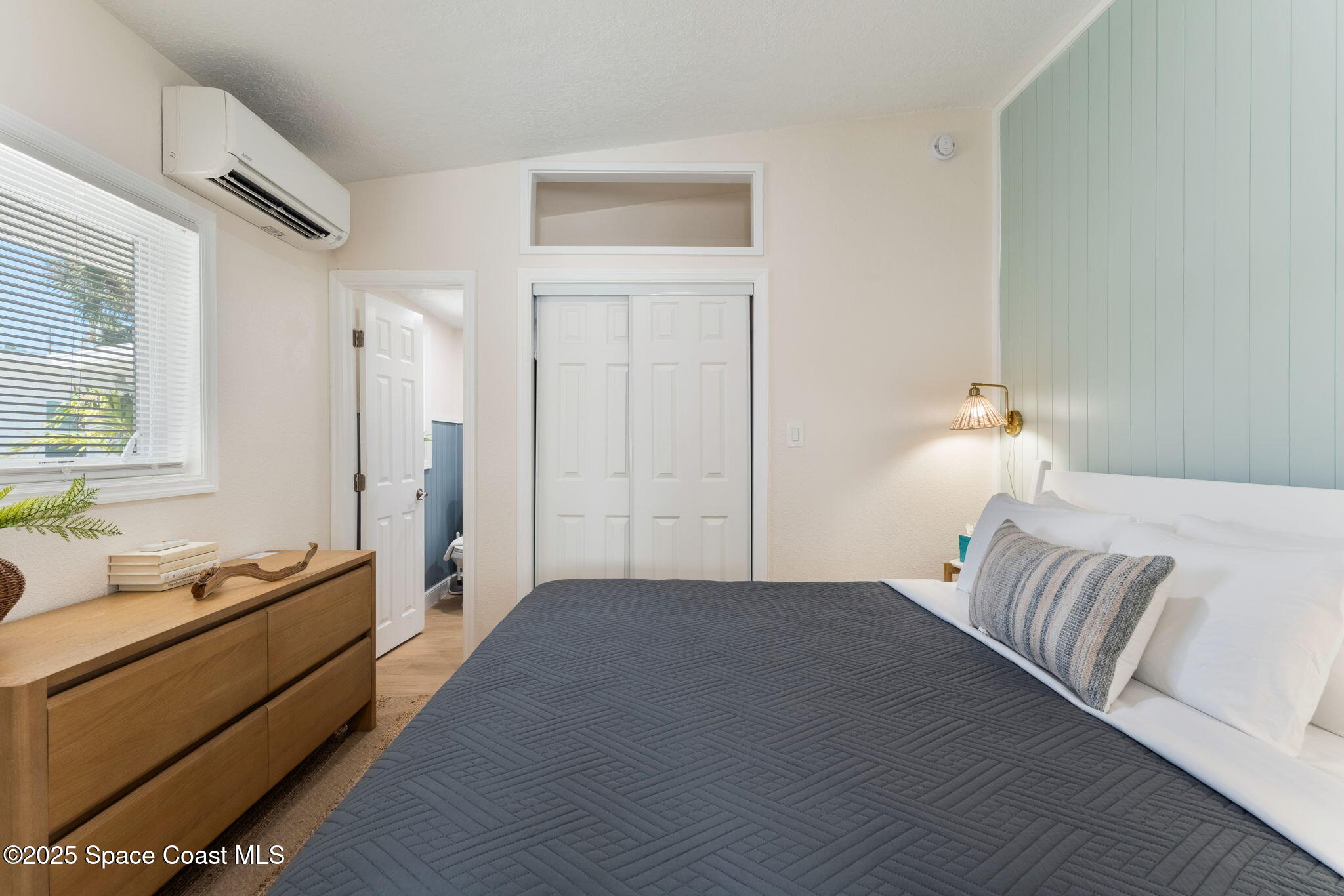 637 South Orlando Avenue Cocoa Beach, FL 32931 - Photo 24 of 83 a bedroom with a bed and a window