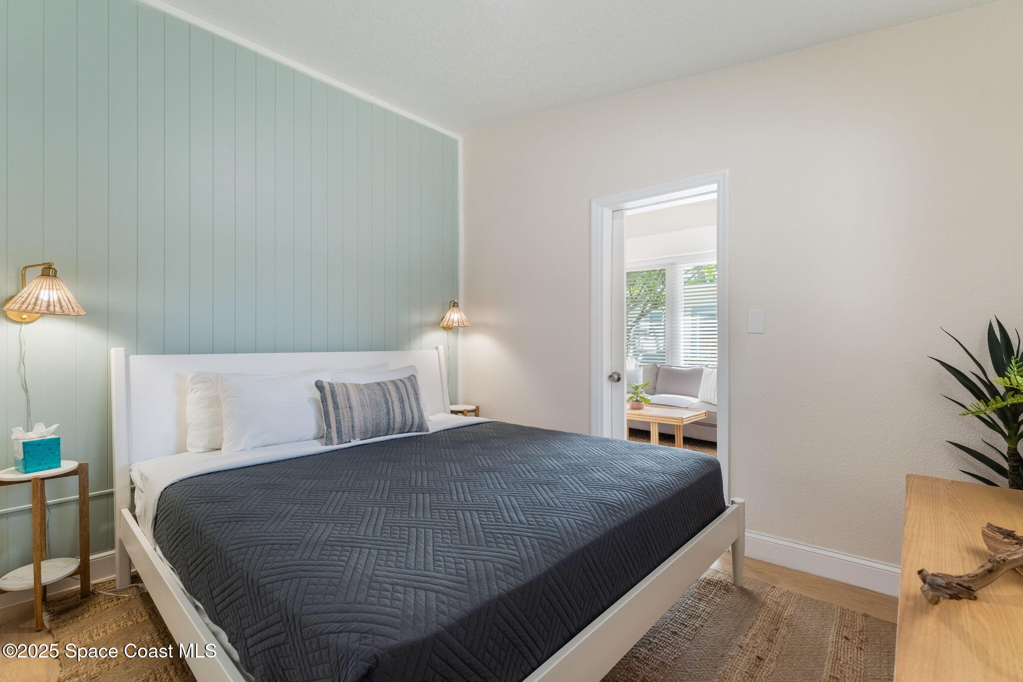 637 South Orlando Avenue Cocoa Beach, FL 32931 - Photo 25 of 83 a bedroom with a bed and window