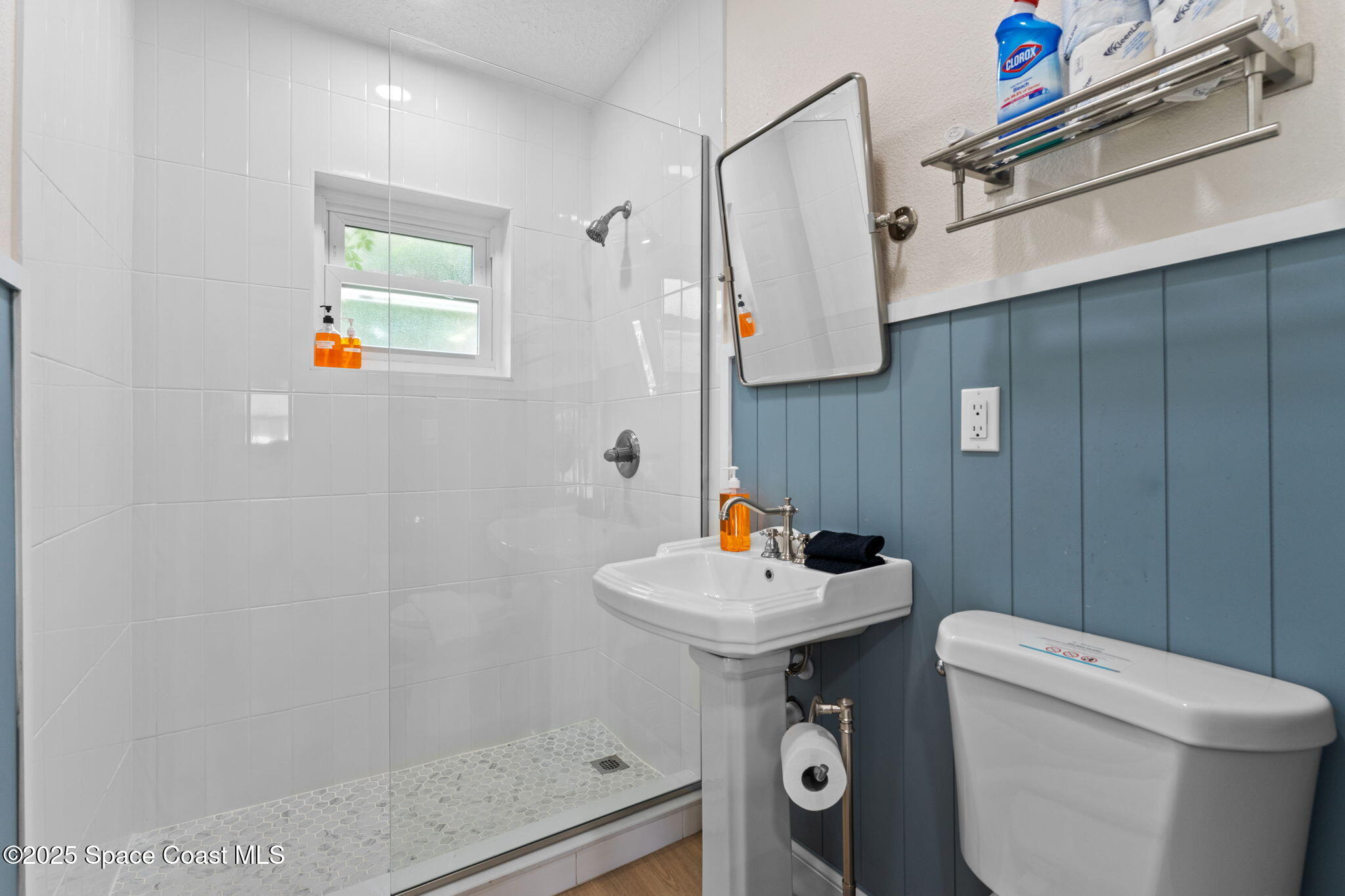 637 South Orlando Avenue Cocoa Beach, FL 32931 - Photo 34 of 83 a bathroom with a sink toilet and shower