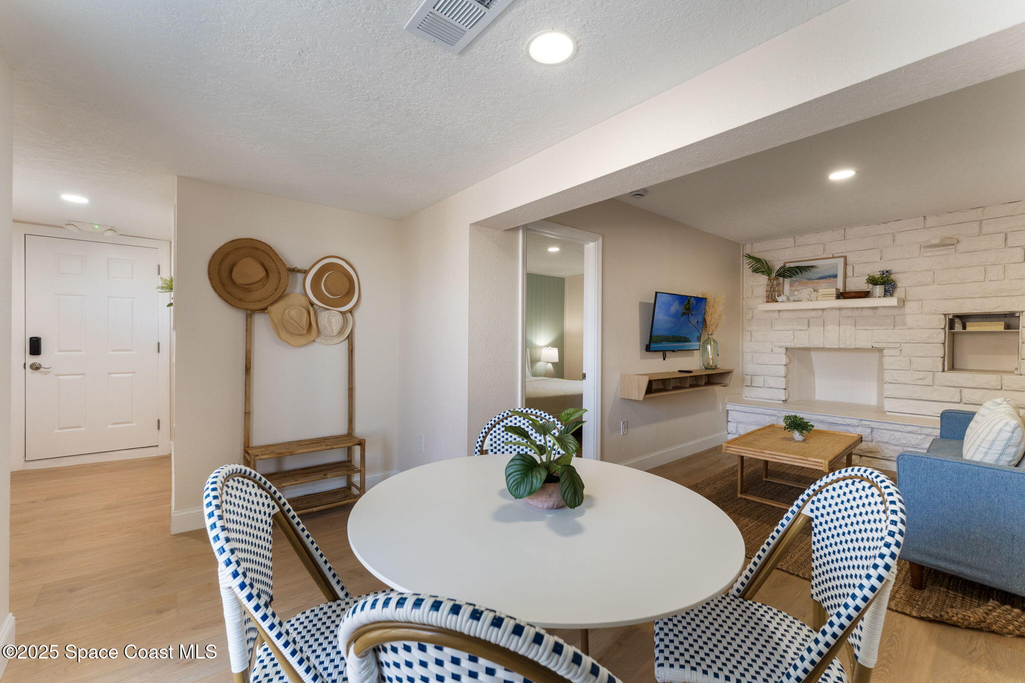 637 South Orlando Avenue Cocoa Beach, FL 32931 - Photo 40 of 83 a living room with furniture a rug and kitchen view