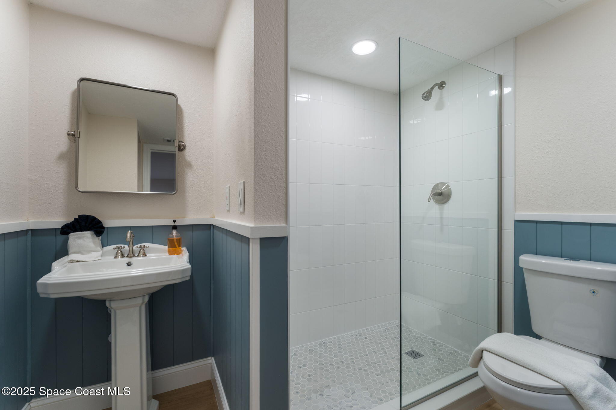 637 South Orlando Avenue Cocoa Beach, FL 32931 - Photo 45 of 83 a bathroom with a sink toilet and shower