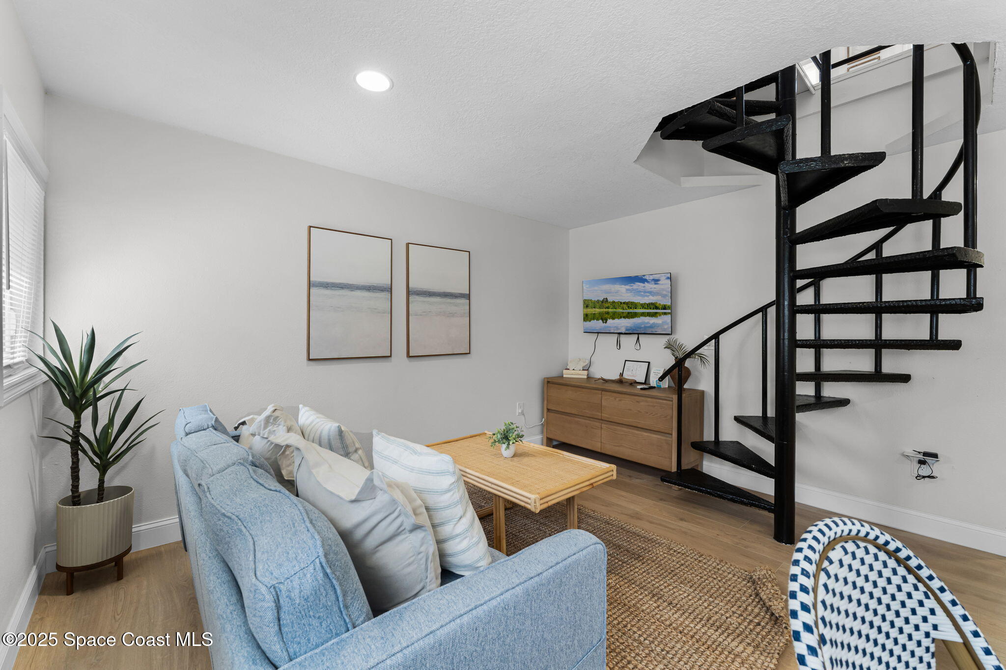 637 South Orlando Avenue Cocoa Beach, FL 32931 - Photo 48 of 83 a living room with furniture and wooden floor