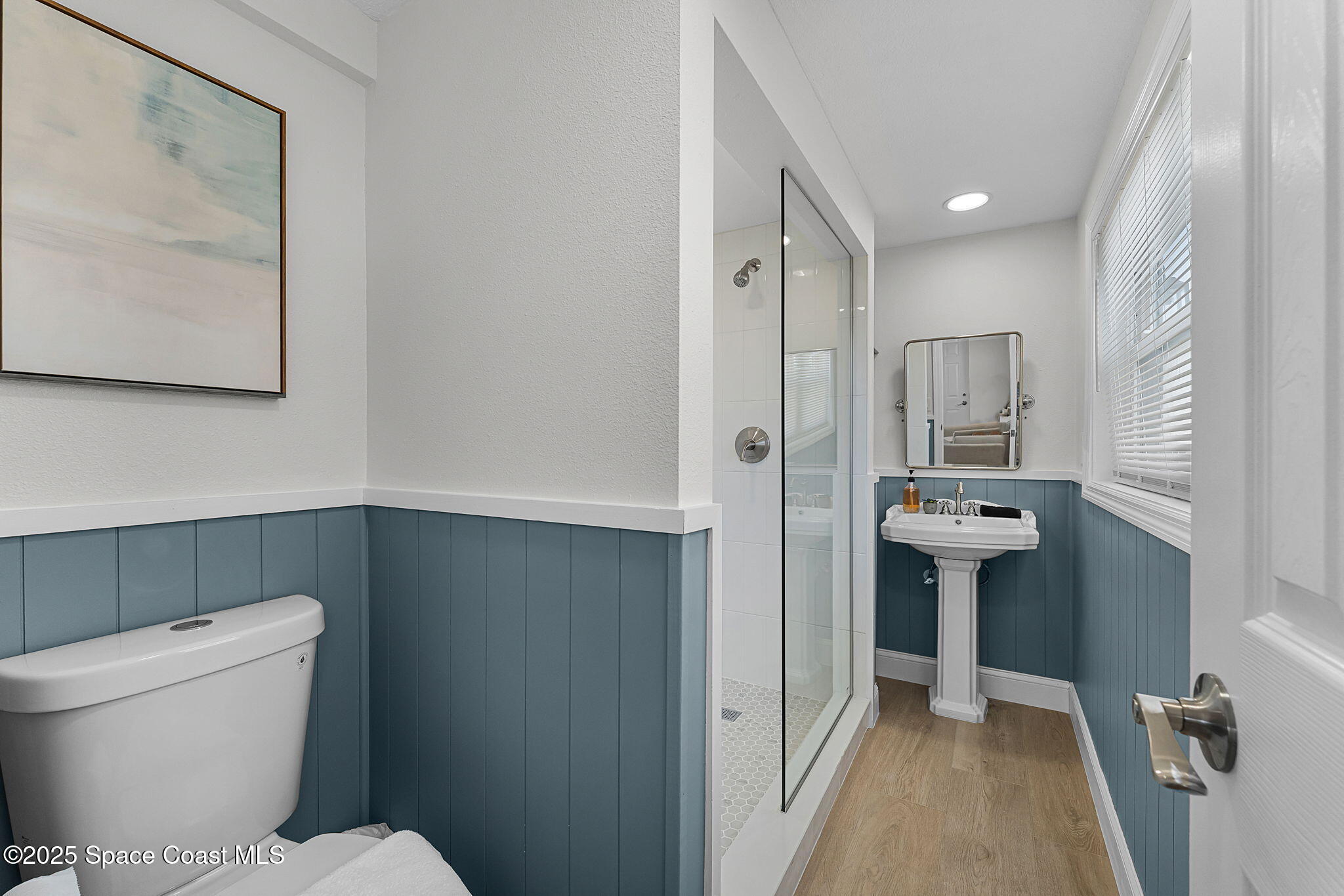 637 South Orlando Avenue Cocoa Beach, FL 32931 - Photo 55 of 83 a bathroom with a toilet sink and shower