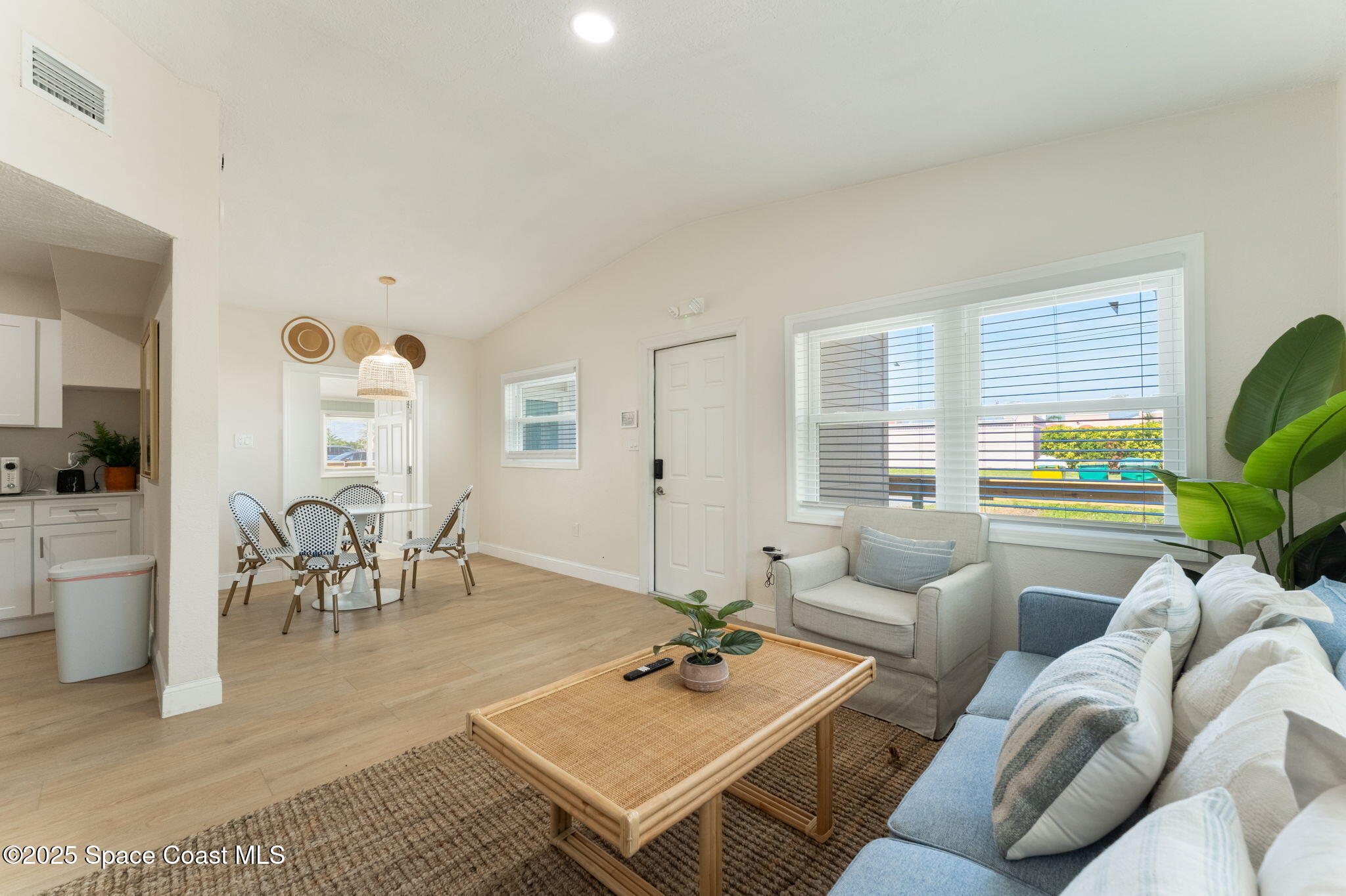 637 South Orlando Avenue Cocoa Beach, FL 32931 - Photo 6 of 83 a living room with furniture and a table