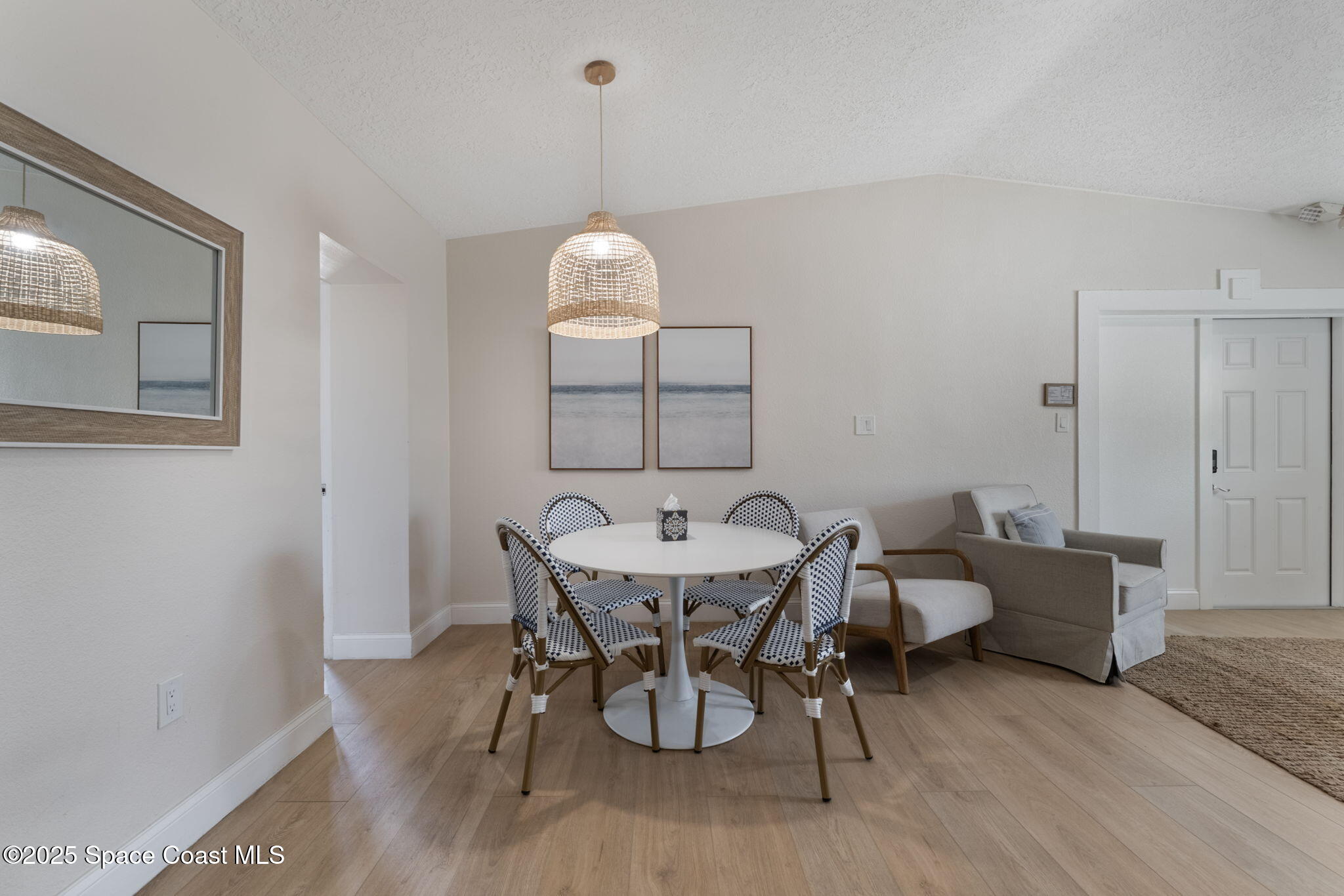 637 South Orlando Avenue Cocoa Beach, FL 32931 - Photo 69 of 83 a view of a dining room with furniture and wooden floor