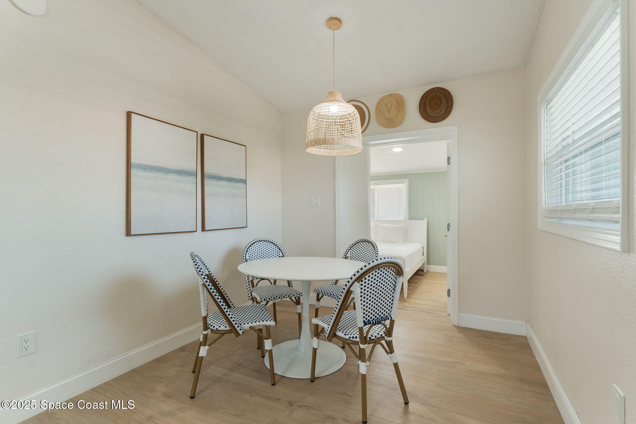 637 South Orlando Avenue Cocoa Beach, FL 32931 - Photo 8 of 83 a view of a dining room with furniture and chandelier fan