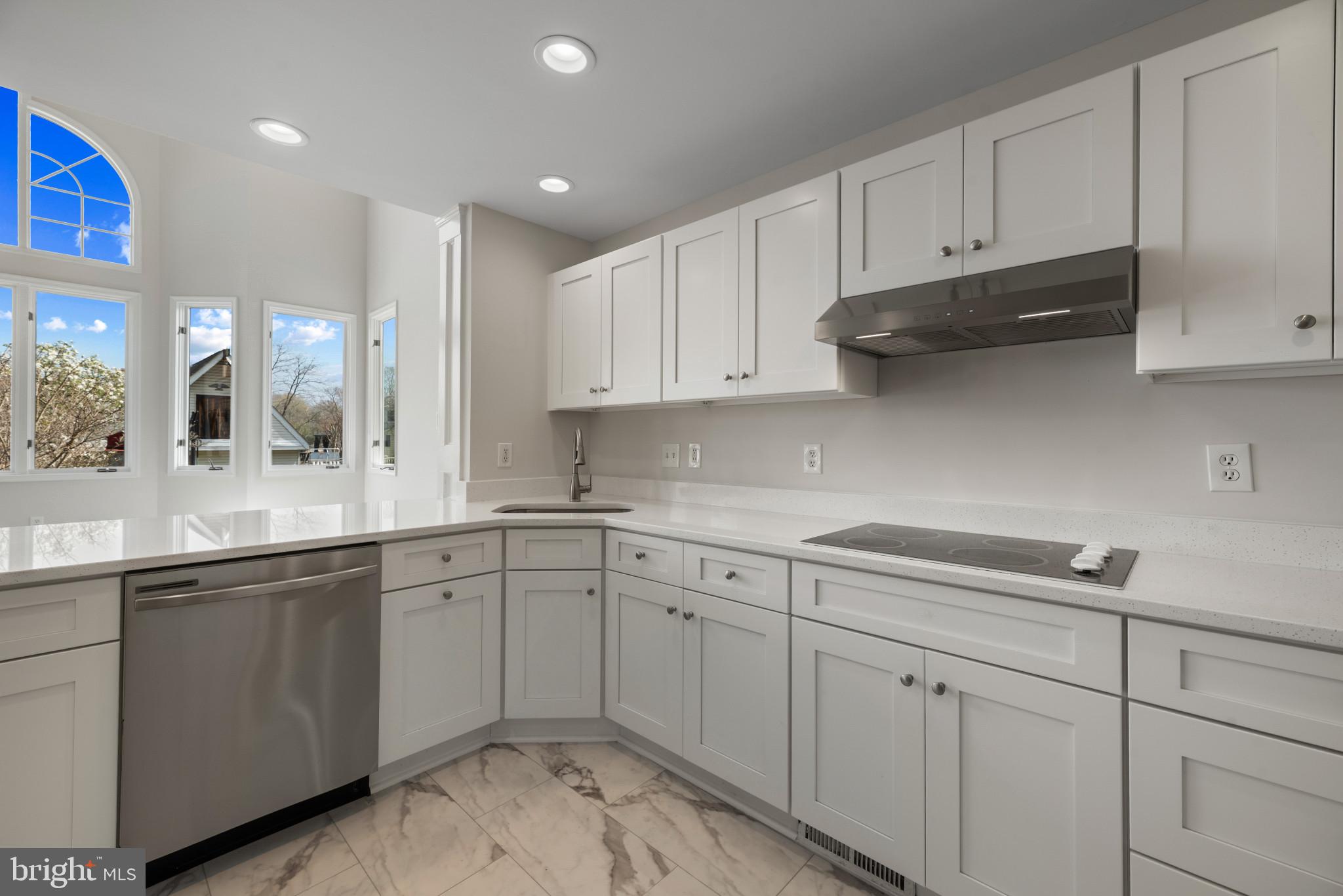 5929 Deale Beach Road Deale, MD 20751 - Photo 11 of 58 Kitchen with white cabinets, dishwasher, light mar
